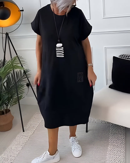 Bessie Relaxed Drop-Shoulder Short-Sleeve Dress with Pockets in Midi Length