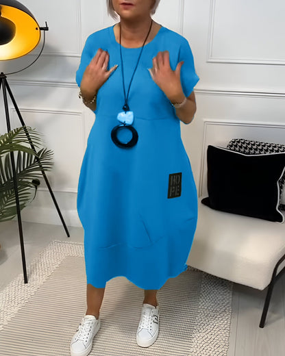 Bessie Relaxed Drop-Shoulder Short-Sleeve Dress with Pockets in Midi Length